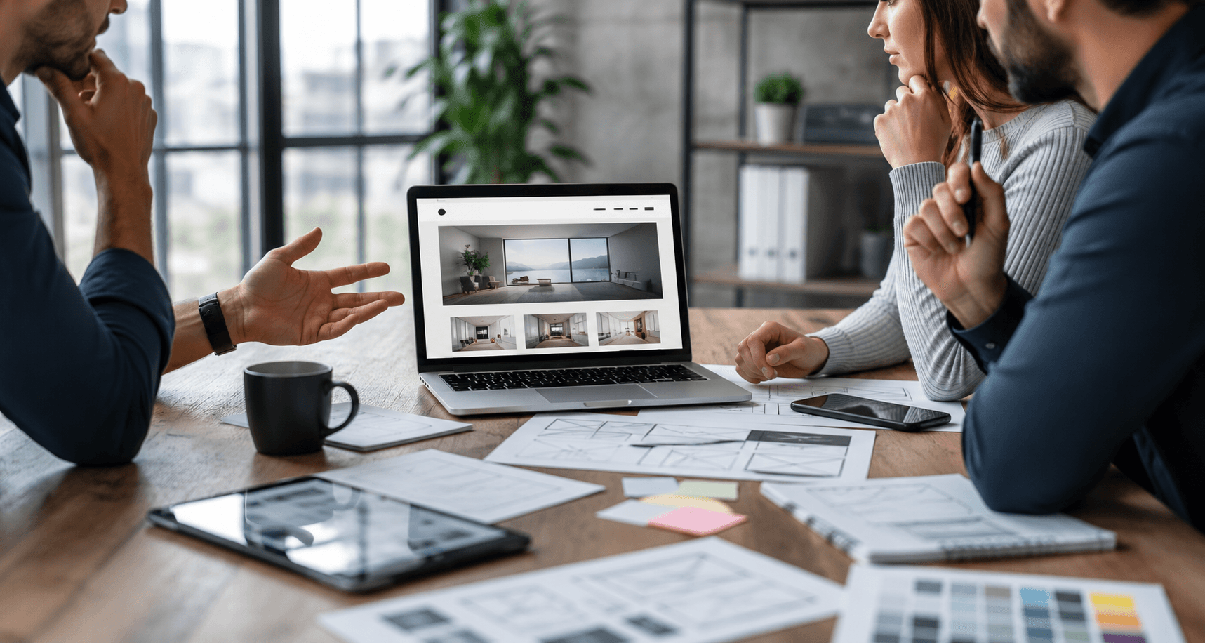 Business team discussing how to choose a web design agency in a modern office